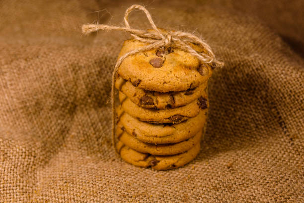 istock Stack of the chocolate chip cookies on sackcloth 1083840668