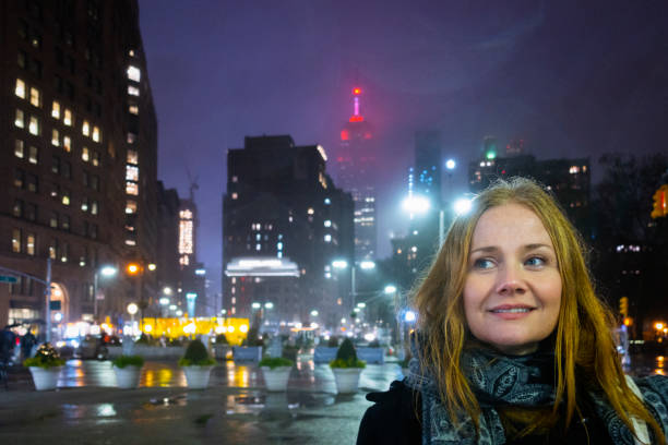 istock Red haired femele in rainy NYC. 1083850122