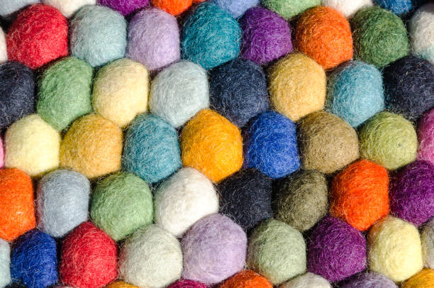 Multi coloured woolen felt balls for fibre craft, background