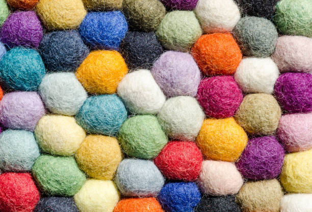 istock Multi coloured woolen felt balls for fibre craft, background 1083850516
