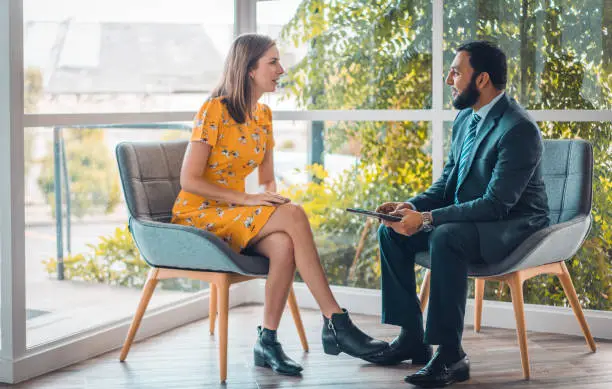 Office worker during one on one business consultation in Auckland, New Zealand.