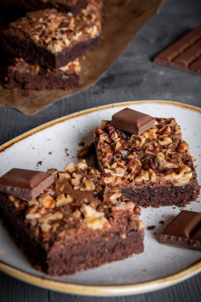 istock Plate with brownie cakes on a gray wooden table 1083857036