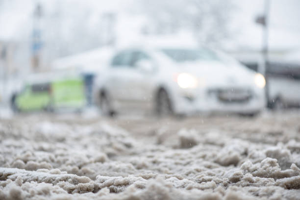 istock Snow slush on road, thaw, warming. Soft background with copy space for text 1083860782