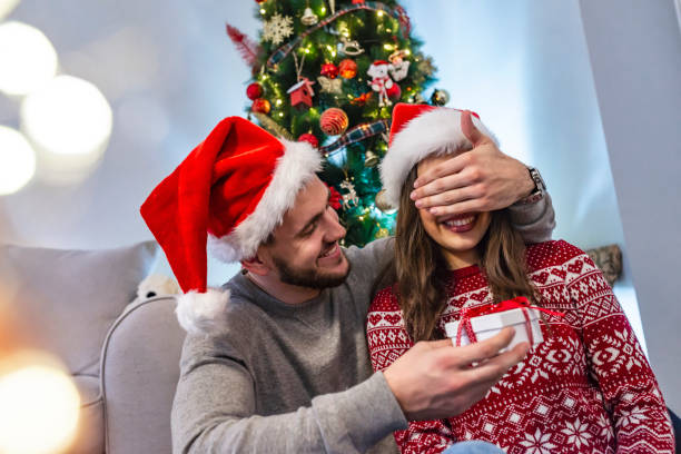 istock Couple with Christmas present 1083862142