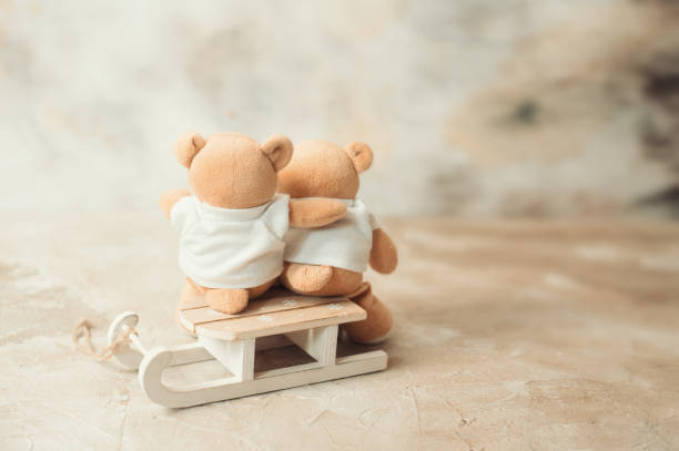 istock two teddy bears holding in one's arms 1083862522