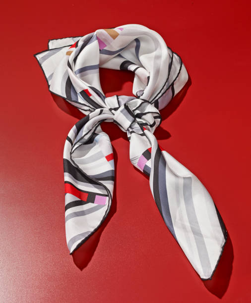 Silk scarf Silk scarf on red background tied knot photos stock pictures, royalty-free photos & images