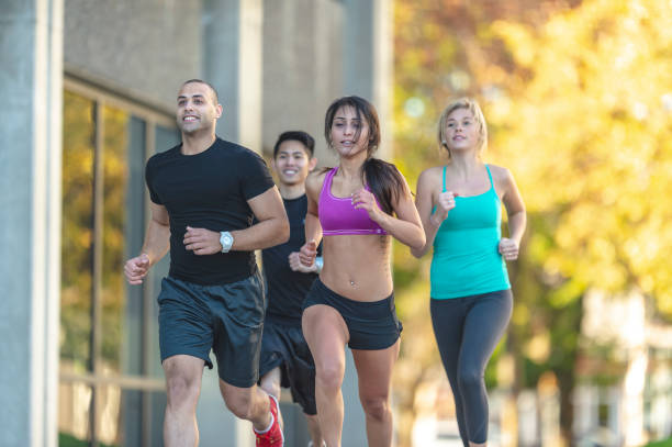 People running in city park