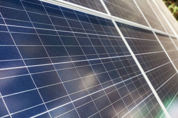 istock Alternative sun energy concept. Close up side view photo of solar panel element 1083872538