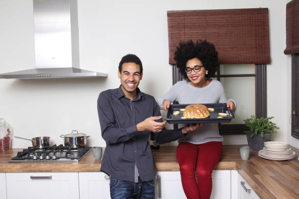 istock Man and woman in the kitchen 1083874630