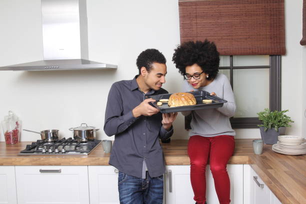 istock Man and woman in the kitchen 1083874640