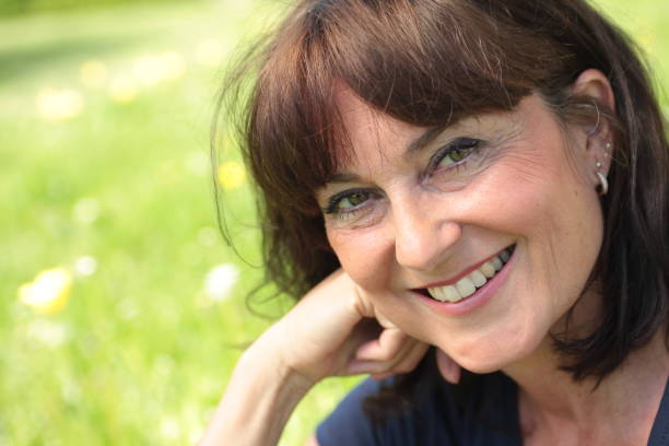 istock Beautiful caucasian mature woman outside 1083879110