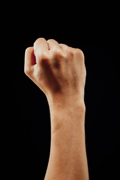 istock male fist on black 1083879876