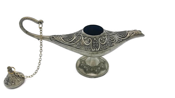 istock Silver open Aladdin's lamp on a white  background. Ornamental textured old metallic lamp with chain and cap. Antique style. 1083881802