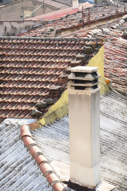 istock Rustic Chimney Roof Tile Rooftops Italian Village 1083882374