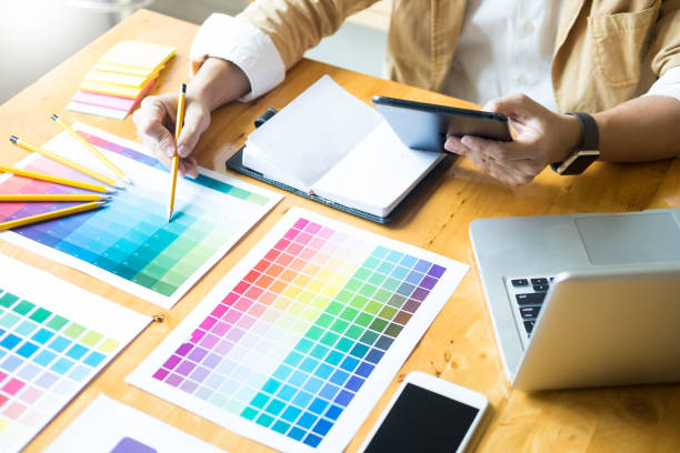 istock Midsection Of Design Professional Analyzing Color Swatches In Office 1083888158