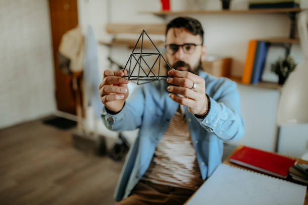 I have my thought Hipster men examining pyramid for designing full product product designer photos stock pictures, royalty-free photos & images