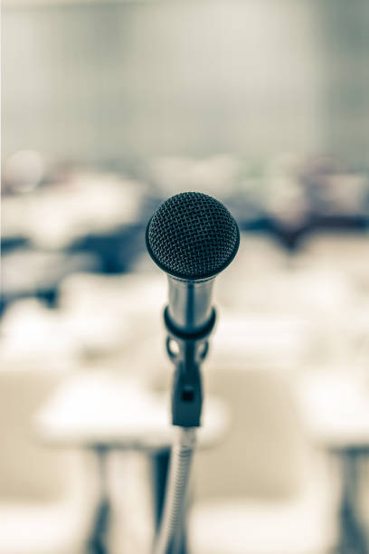 istock Microphone speaker in school lecture hall, seminar meeting room or educational business conference event for host, teacher or coaching mentor 1083896052