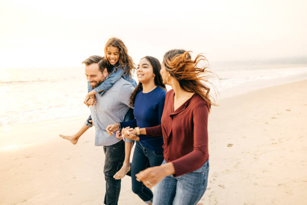 istock Sunset at the beach with family 1083896554