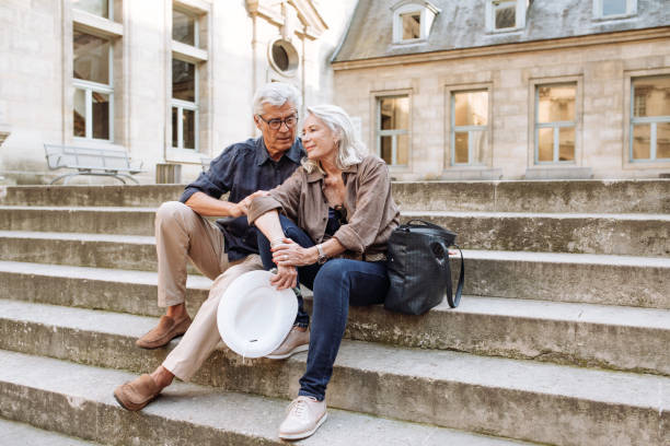 istock Senior couple walking around the city 1083896754