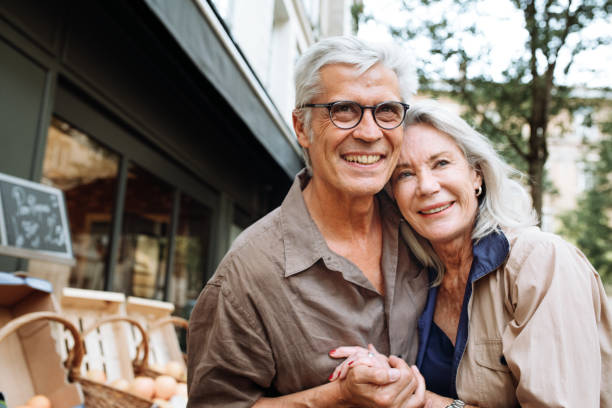 istock Senior couple walking around the city 1083896810