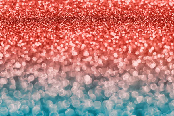 istock Blurred glitter background living coral color. 1083899762