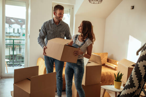They can't contain their excitement Lovely couple moving into new apartment unpacking stock pictures, royalty-free photos & images