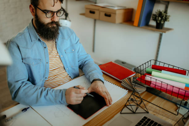 istock Man designing new product 1083901250
