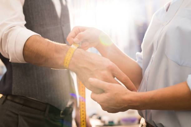 istock Tailor Measuring Wrist Close Up 1083903226
