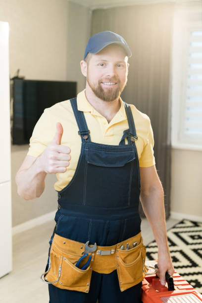 istock Cheerful handyman showing thumb-up 1083903954