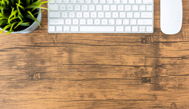 istock office desk with computer and office supplies top view 1083930610