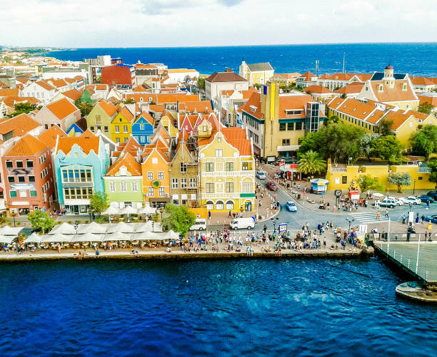 View of Punda in Willemstad, the Capital of Curacao View of Punda in Willemstad, the Capital of Curacao, in the Netherland Antilles, one of the main tourist attractions on the Caribbean and one of the main destinations for cruise ships that travel over the Caribbean Sea.  One of the main characteristics of the island is the colorful architecture of the constructions. curaçao stock pictures, royalty-free photos & images