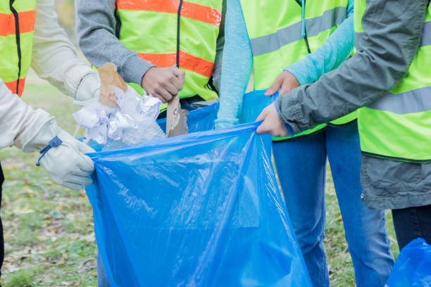 istock Group of unrecognizable community volunteers pick up litter 1083936302