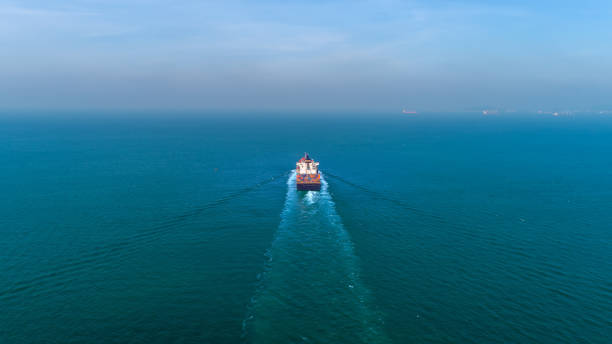 istock Aerial view container ship at sea for import export, shipping or transportation. 1083936322
