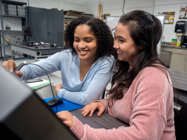 istock Teenage girls work on project in engineering class 1083937746