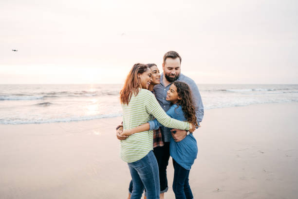 istock Sunset at the beach with family 1083939470