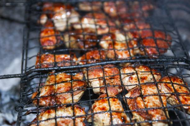 istock chicken grilled shashlik on the grill. Fried crust. 1083941618