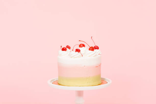 istock Birthday Spumoni cake on pink background. 1083947788