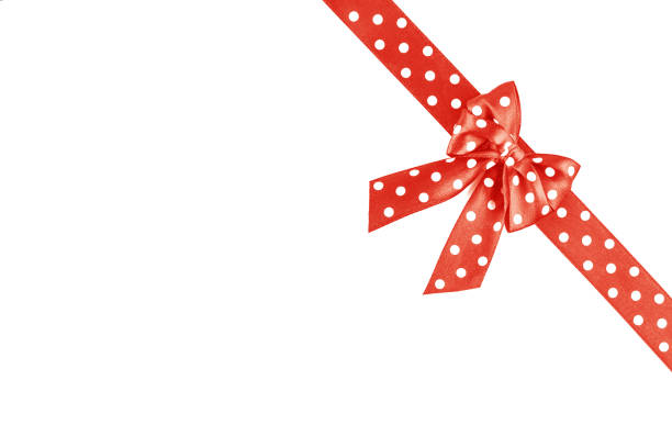 Shiny Coral silk ribbon isolated on white background. Festive concept. Flat lay. Color of year 2019.