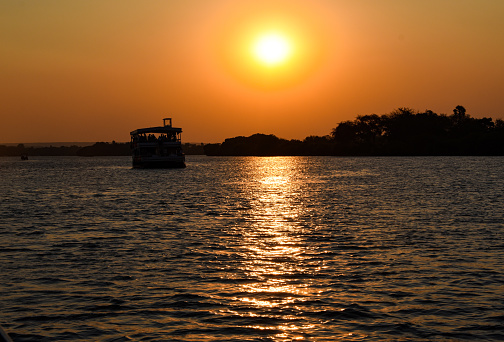 Sunset cruise on the Zambezi River while on safari in Zimbabwe