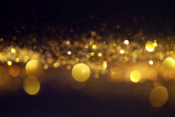 istock Blurred background with yellow lights on black 1083963798