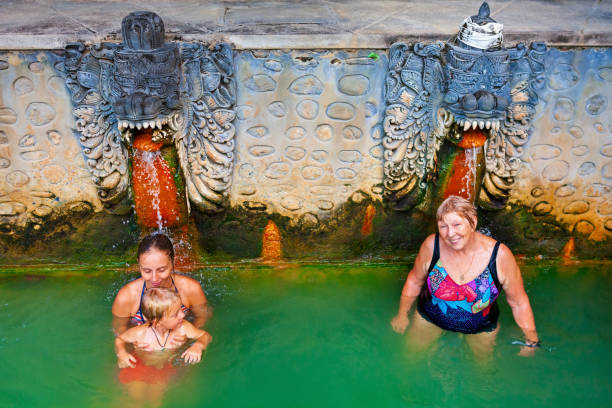 istock People in natural hot spring Air Panas Banjar on Bali 1083965908