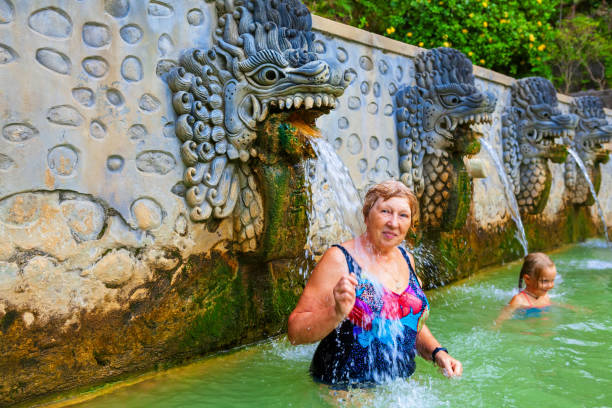 istock People in natural hot spring Air Panas Banjar on Bali 1083968264