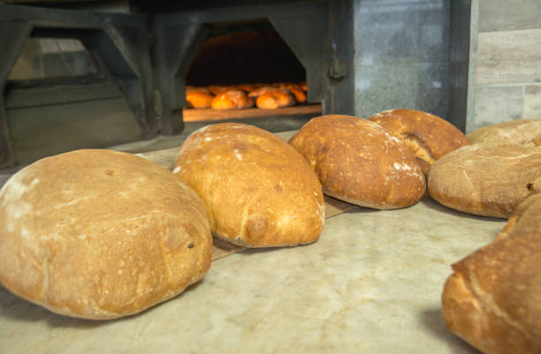 istock Village bread in front of the oven 1083970832