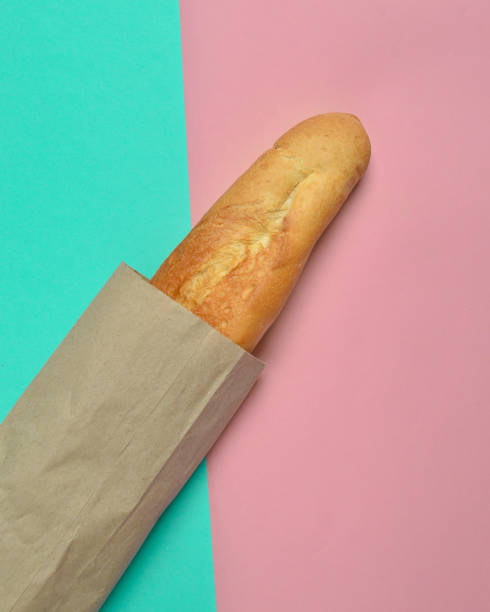 istock French baguette on a pastel background. Minimalist trend. Top view 1083975896