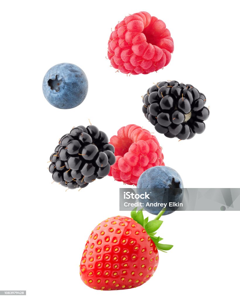 Falling wild berries mix, strawberry, raspberry, blueberry, blackberry, isolated on white background, clipping path, full depth of field Fruit Stock Photo