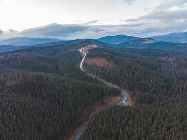 istock aerial view of highway in mountains on sunset 1083981804