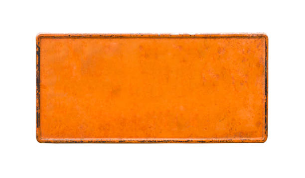 old orange vehicle license plate with copy space isolated on white background,Blanked rusted vehicle license plate