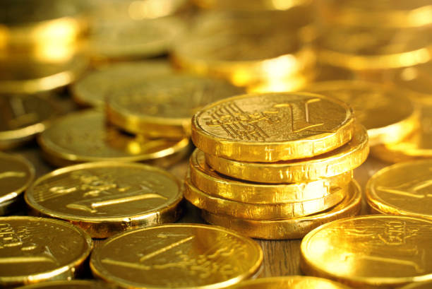 istock Gold coin on wood table 1083992026