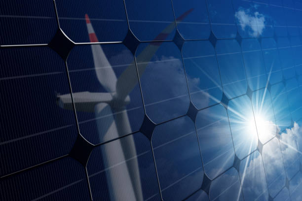 istock Solar panel with the reflection of a wind turbine 1083992534