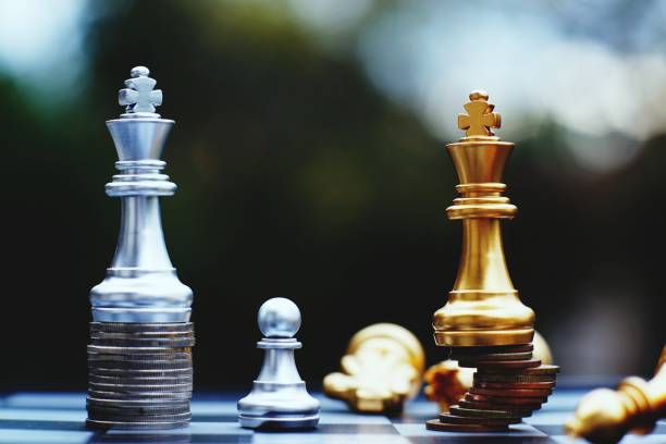 istock Chess board game, business competitive concept, strong financial capital advantage situation against unstable finance team, winner and loser 1083999218